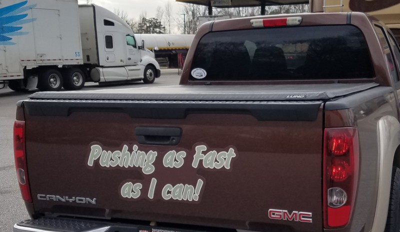 Pushing as Fast as I can! decal on a pickup tailgate