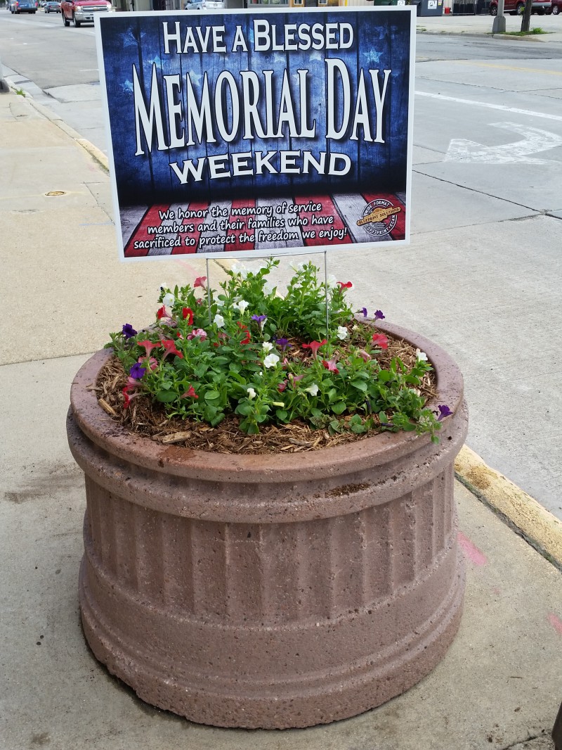 Have a Blessed Memorial Day Weekend yard sign in a planter