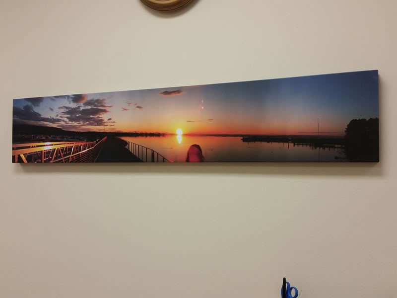 Panoramic sunset canvas on a wall